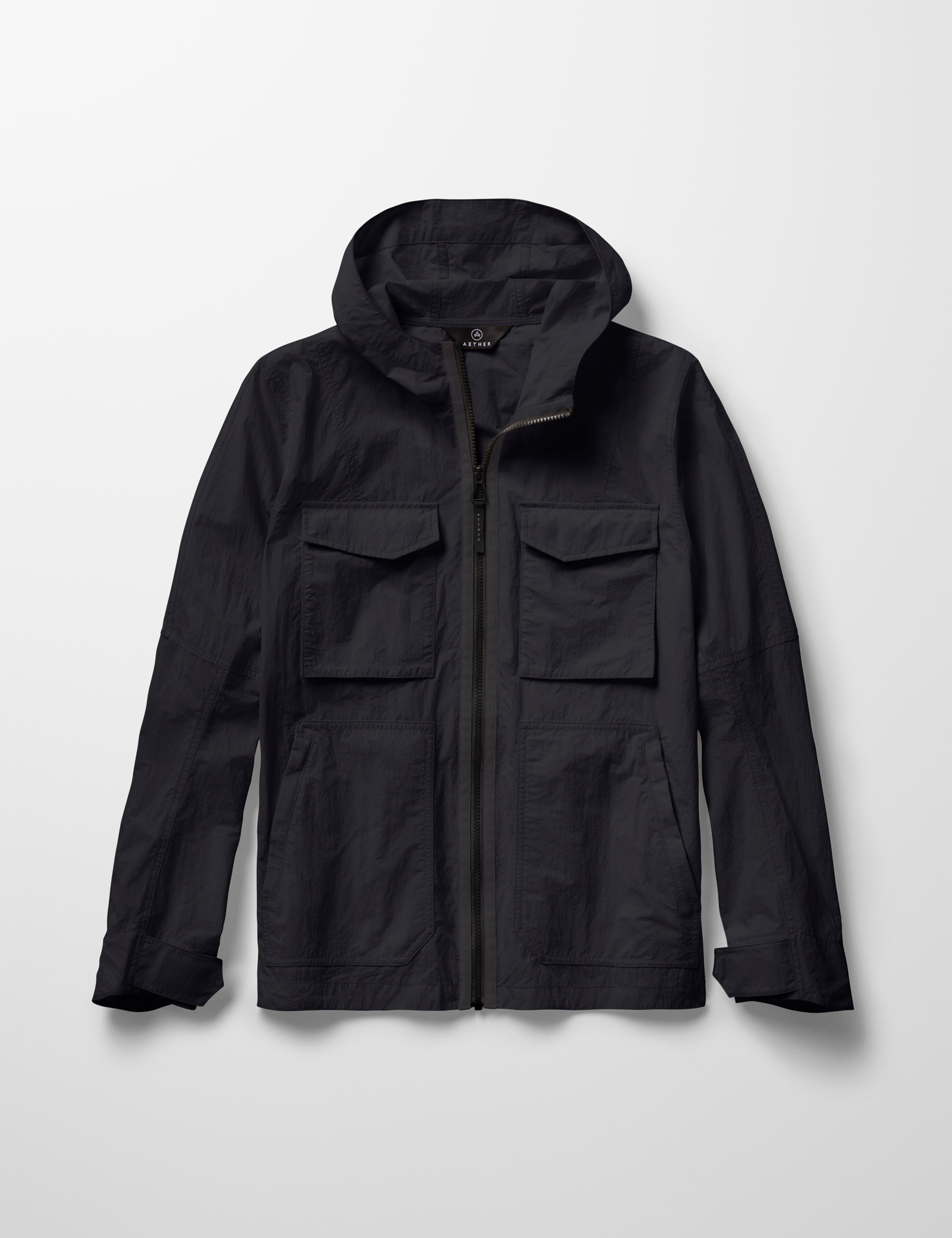 Studio laydown of Aires Lightweight Windbreaker in Onyx Black