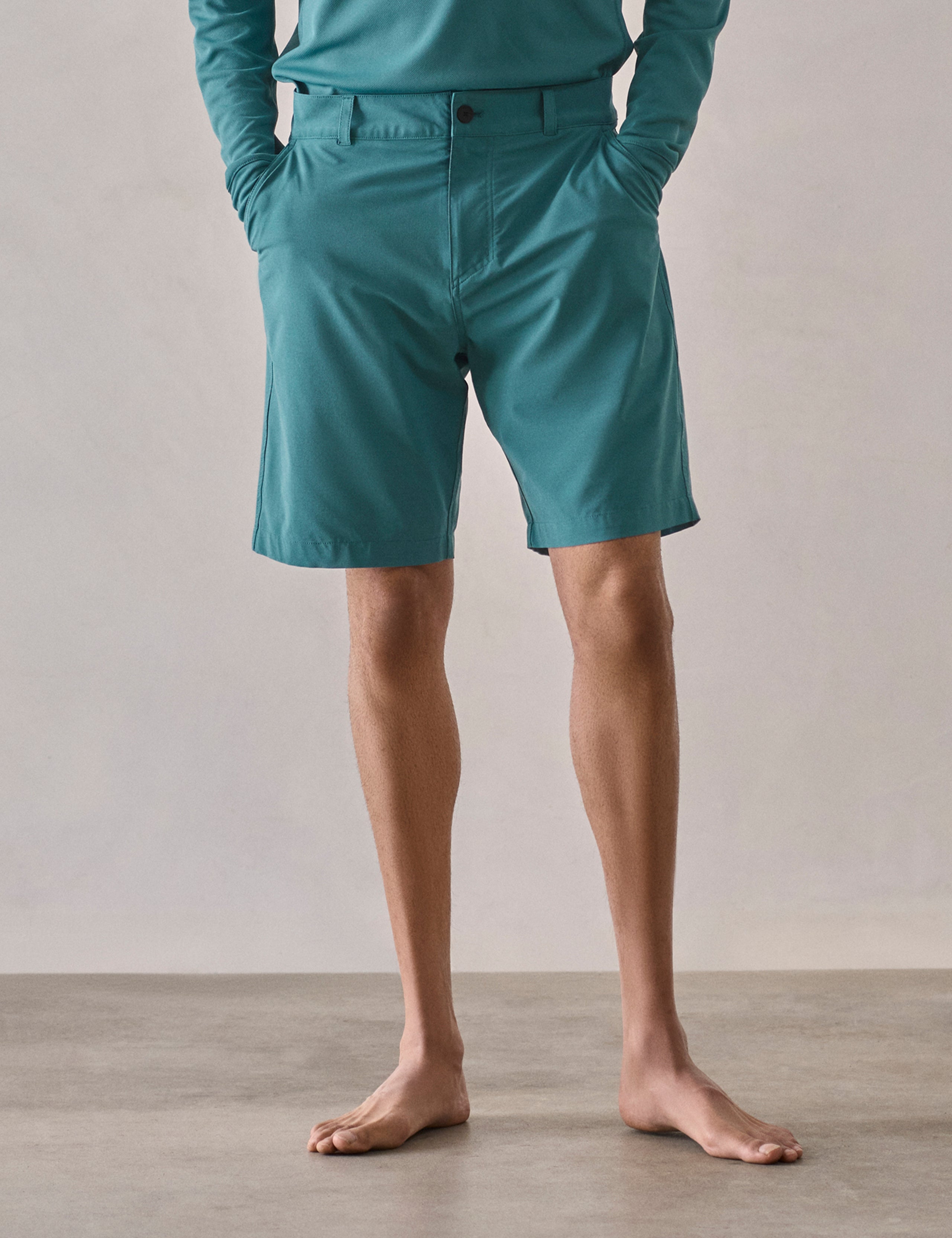 Front lower-body view of man wearing Catalina Submersible Short in Aqua Blue from AETHER Apparel.