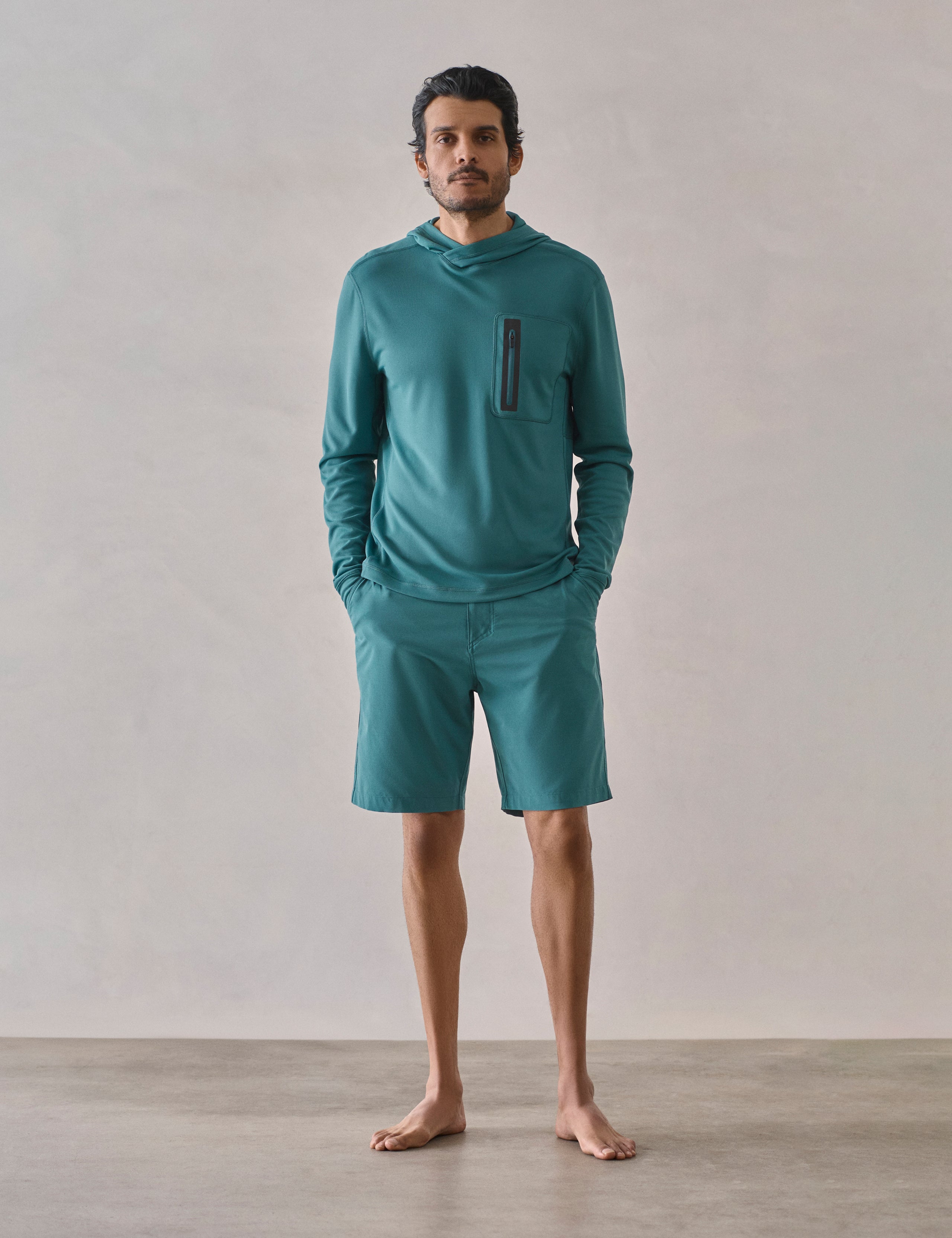 Front full-body view of man wearing Catalina Submersible Short in Aqua Blue from AETHER Apparel.