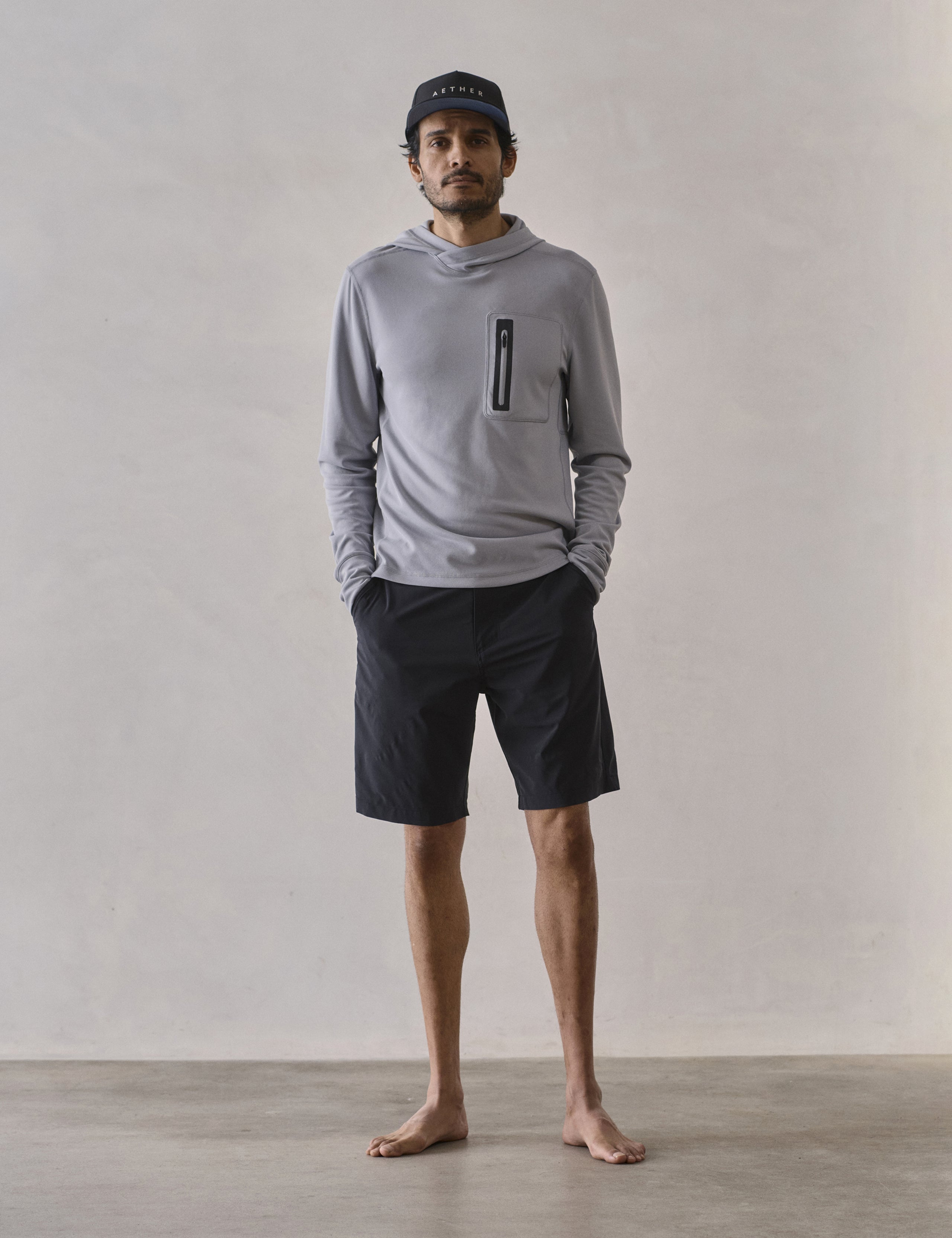 Front full-body view of man wearing Catalina Submersible Short in Onyx Black from AETHER Apparel.