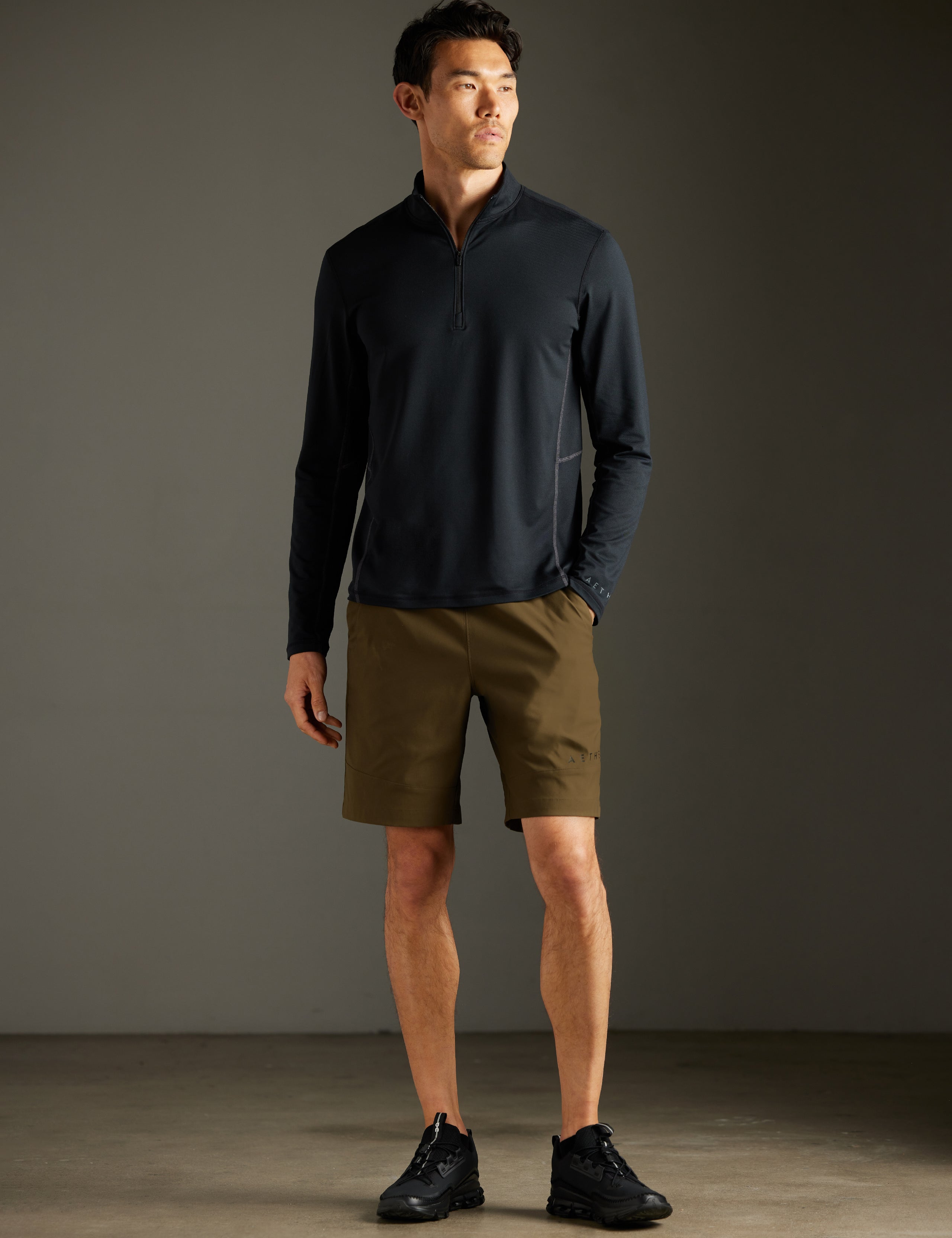 Front full-body view of man wearing Perth Short in Cadet Green from AETHER Apparel.