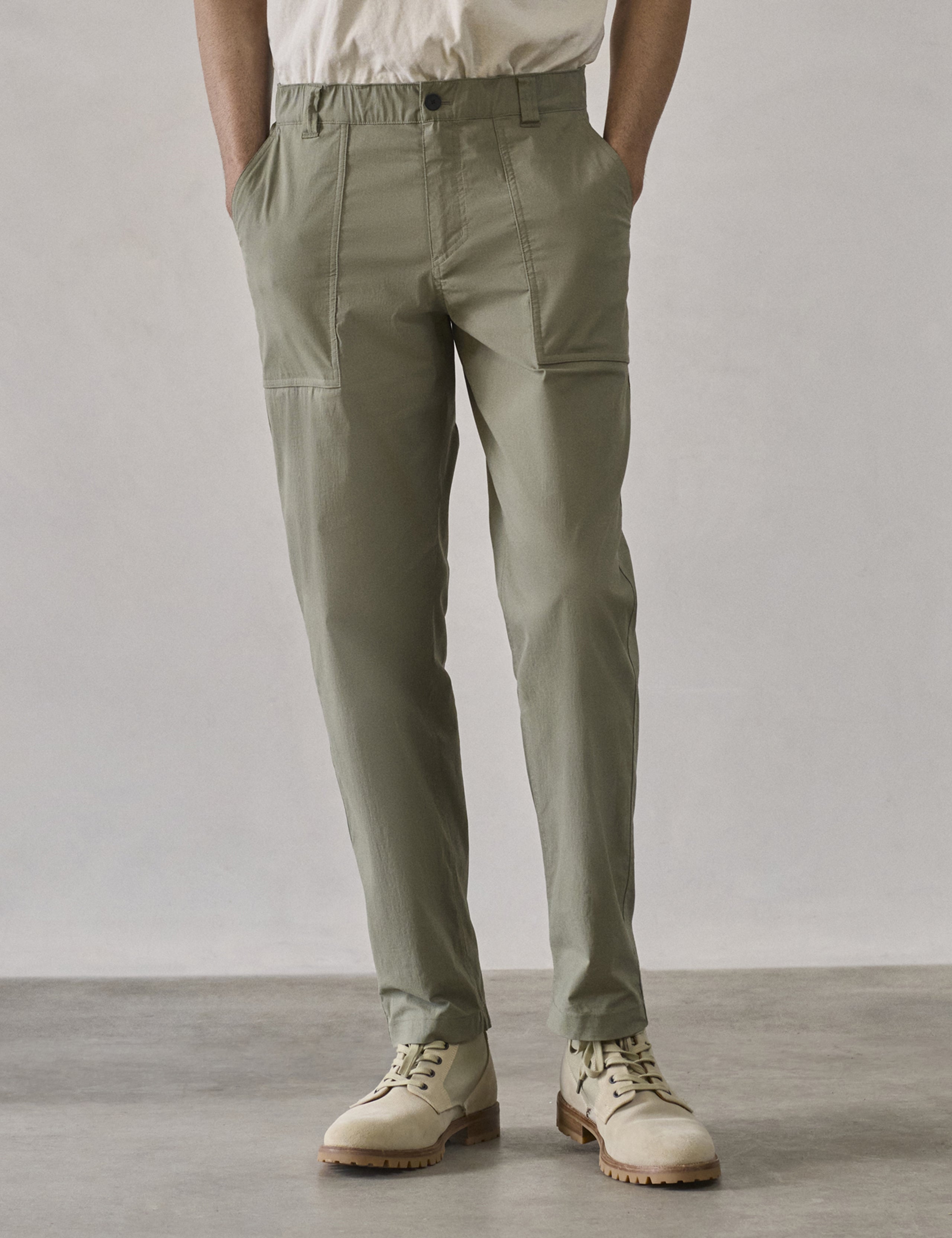 Front lower body view of man wearing Zermatt Hiking Pant in Fern Green from AETHER Apparel.