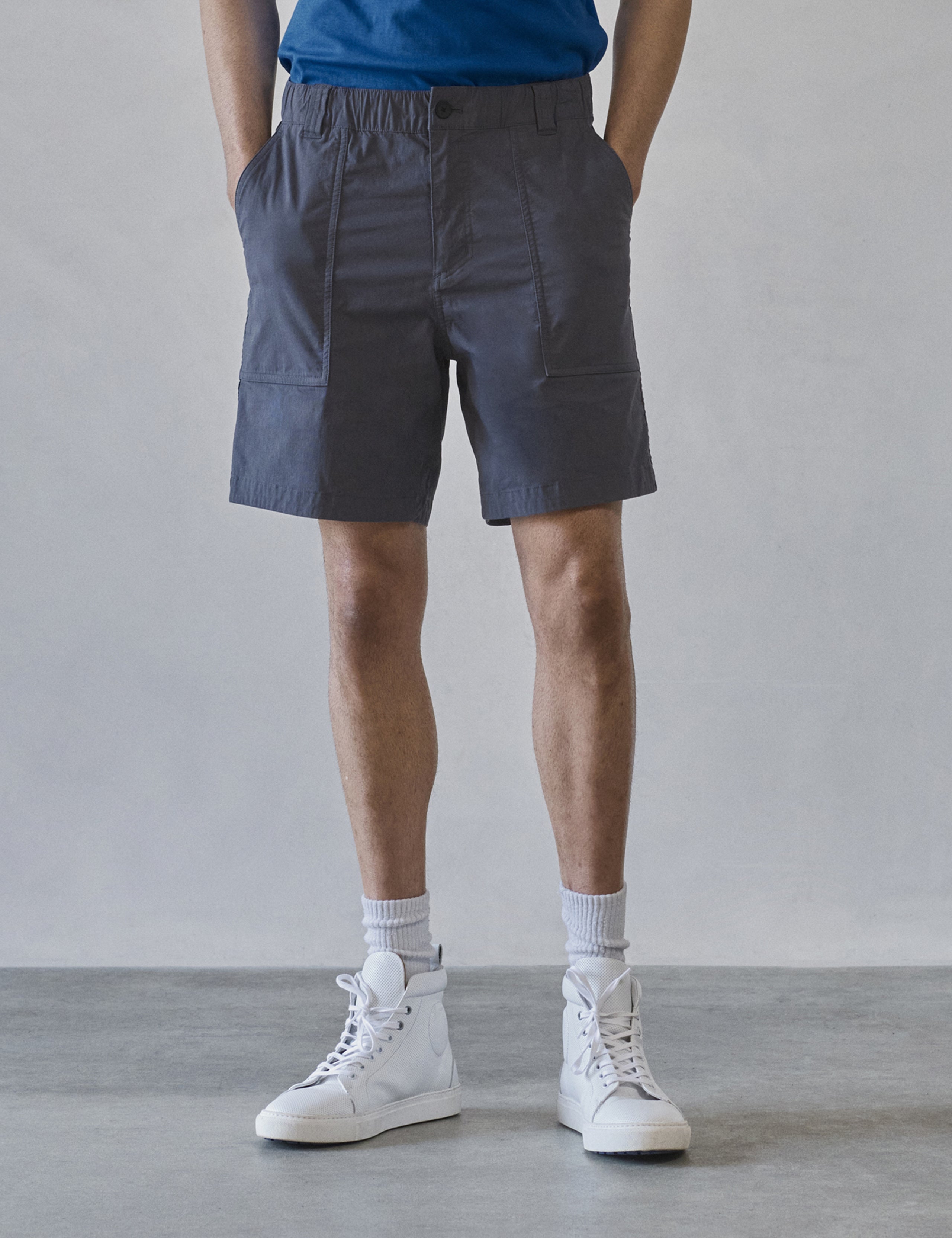 Front lower body view of man wearing Zermatt Hiking Short in Graphite from AETHER Apparel.