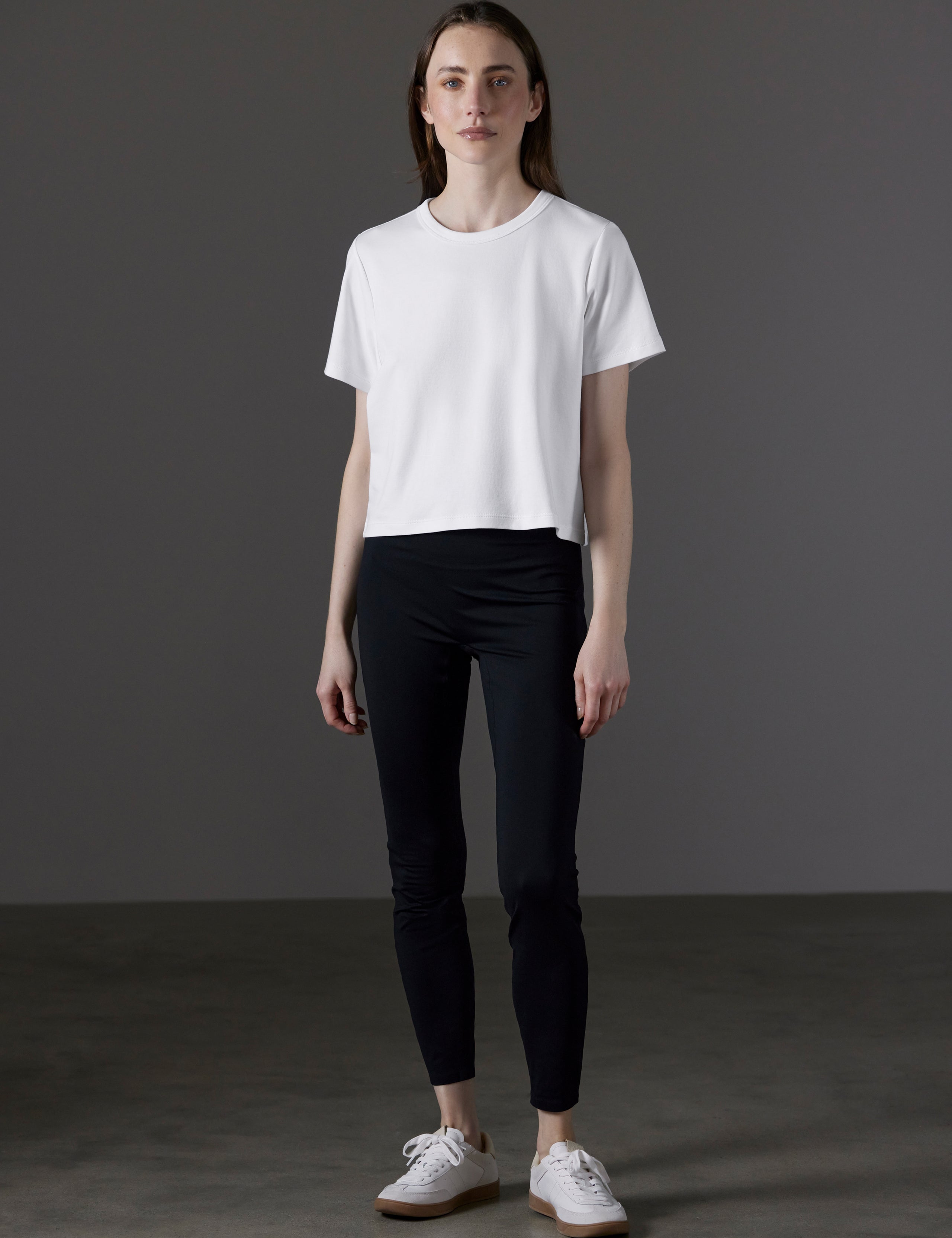 Front full-body view of woman wearing Emery Pima Cropped Tee in White from AETHER Apparel.