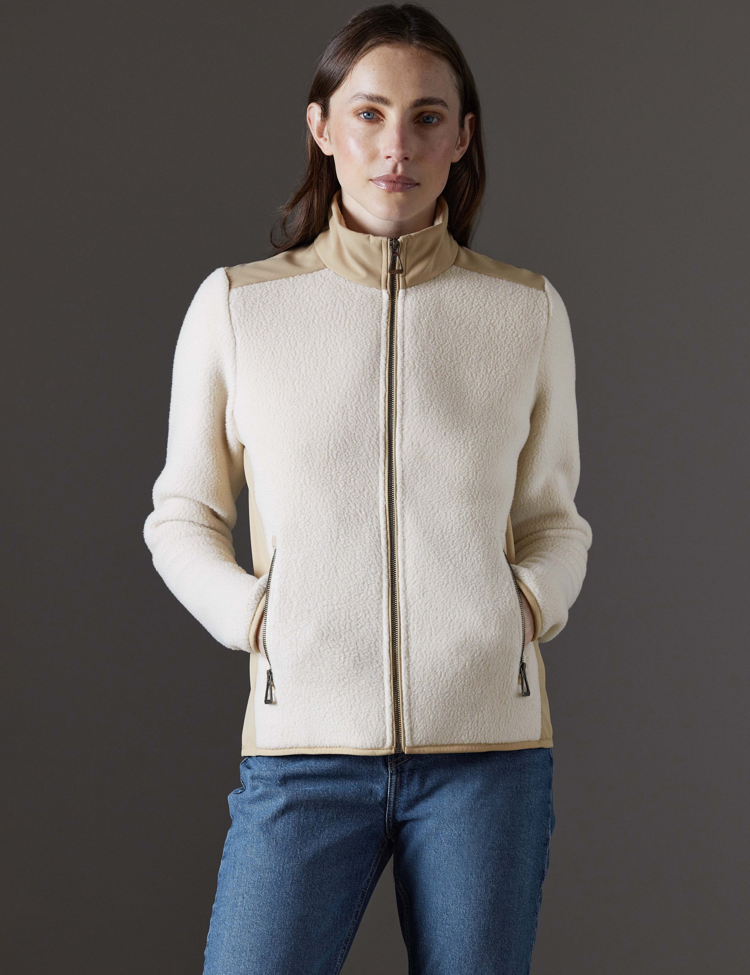Front body view of woman wearing Walsh Full-Zip 2.0 in Bone and Desert Tan from AETHER Apparel.