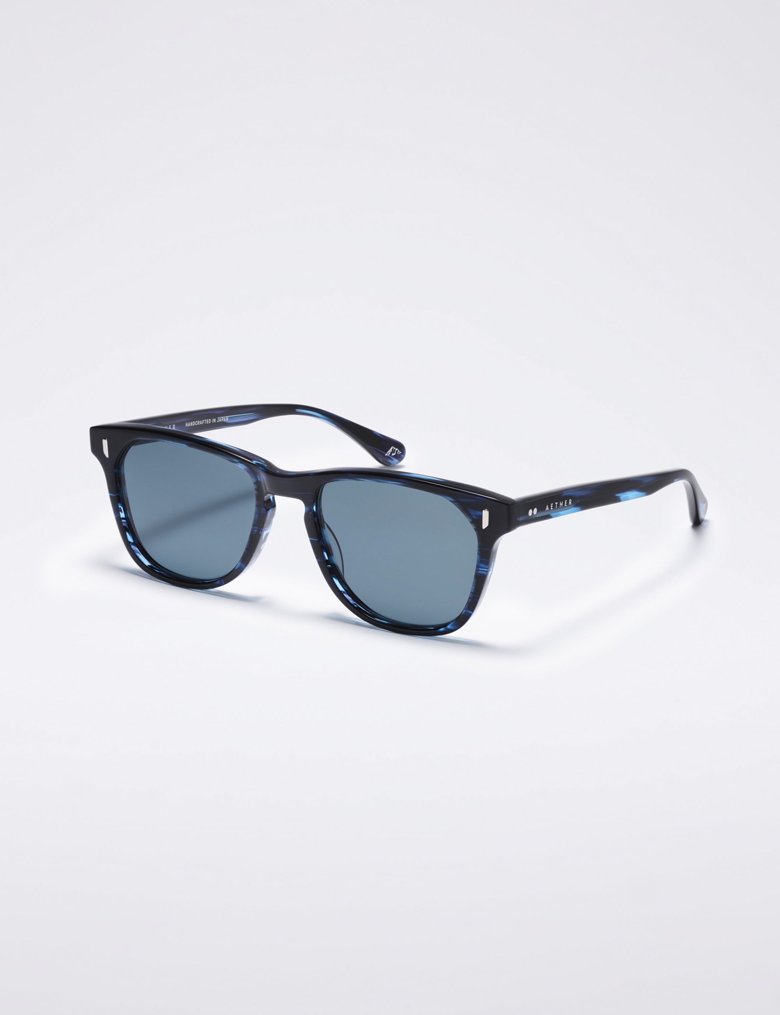 Front 3/4 view of Yosemite Sunglass in Blue Tortoise with Blue Lens from AETHER Apparel.